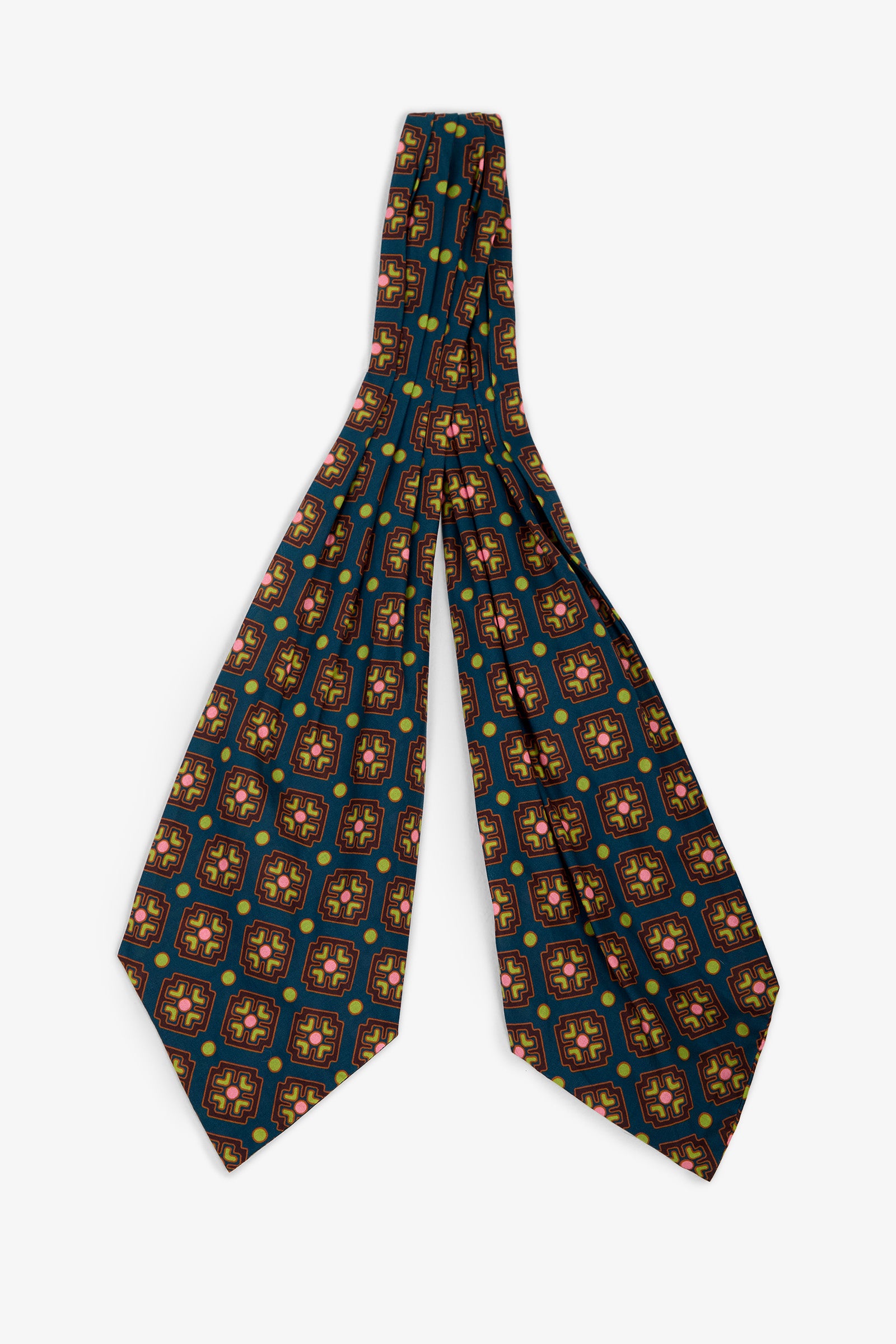 An Ascot featuring a geometric pattern in green, yellow, and red on a dark blue silk background, laid flat against a white surface.