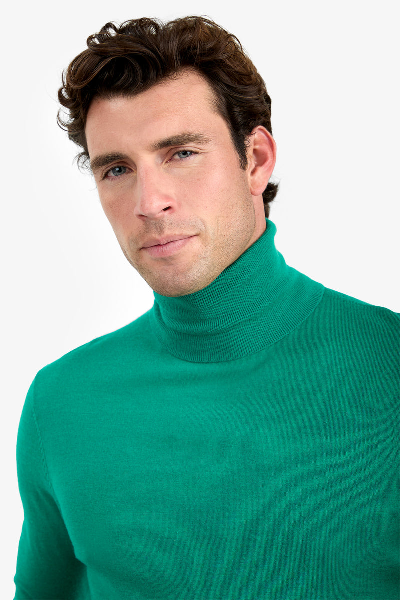 A man with short brown hair wearing the WOODROW TURTLENECK in bright green, looking at the camera with a neutral expression against a plain white background.