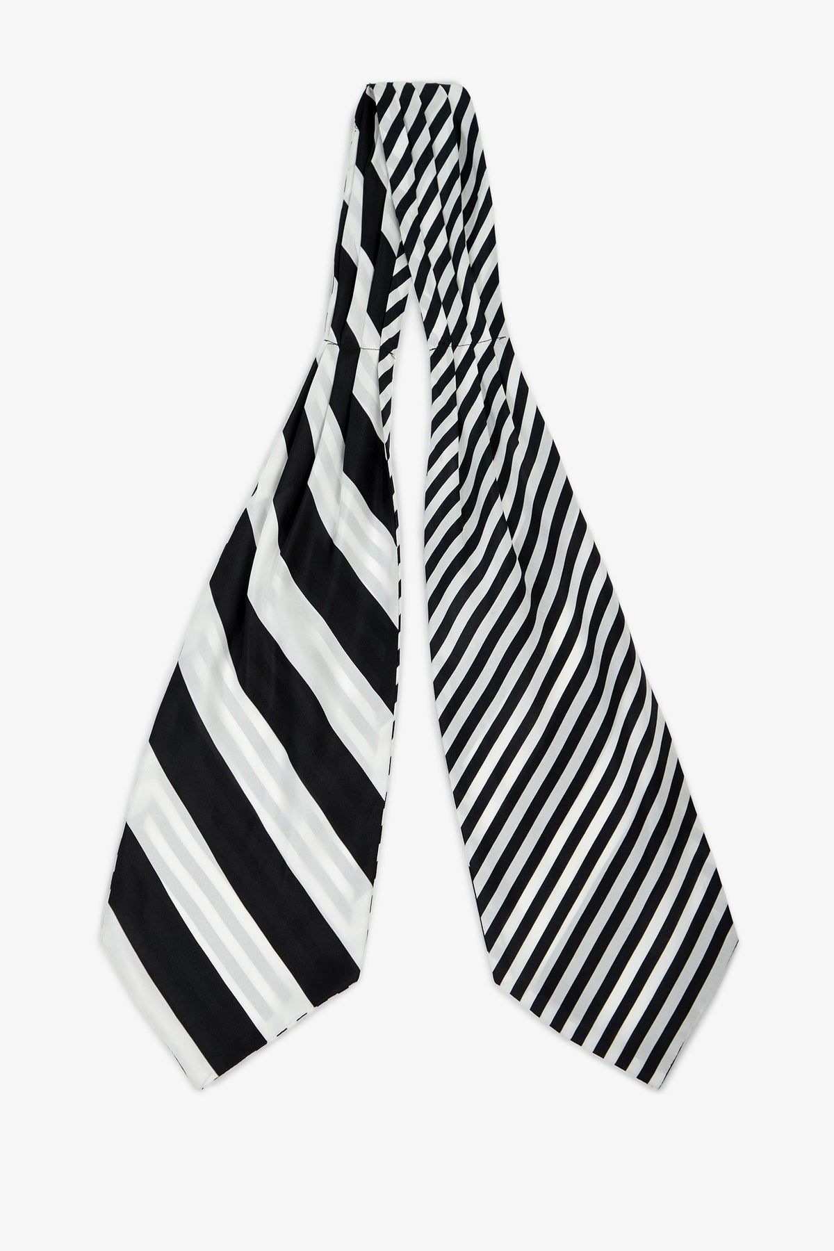 The Savoir Stripe Silk Ascot features two wide ends with contrasting black and white diagonal stripes—the left side showcases bold, thick stripes, while the right side displays thinner, closely spaced stripes.