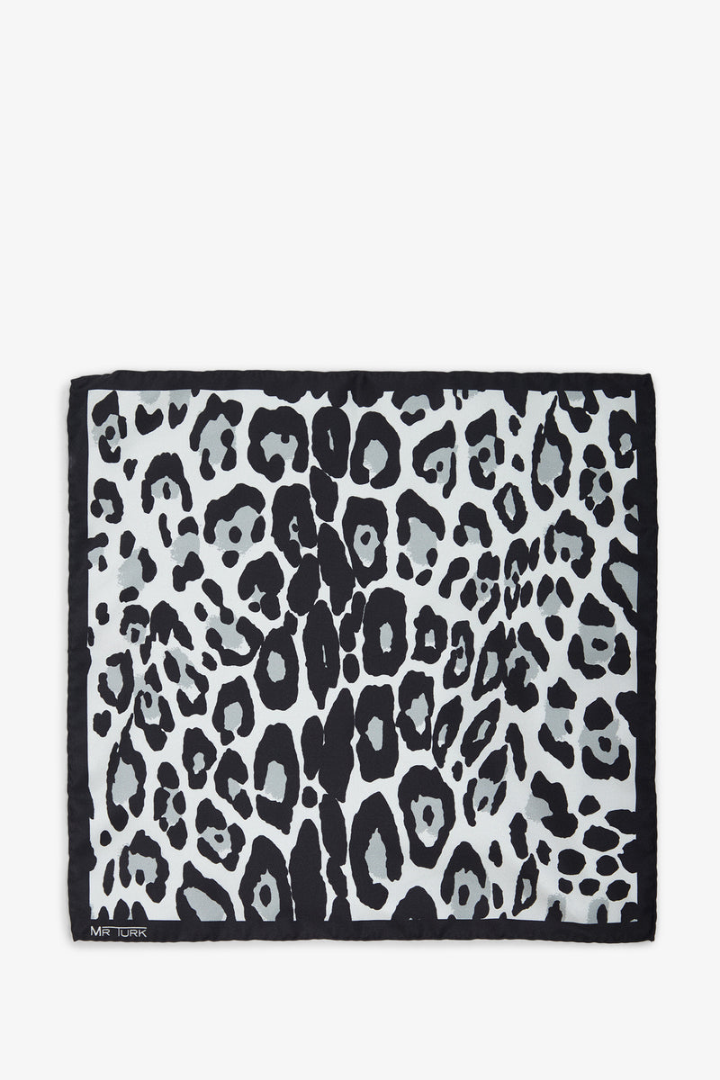 Rectangular pocket square with a black border and bold black and gray leopard print. Features MR TURK in small white letters in one corner. Product name: Snow Leopard Pocket Square.