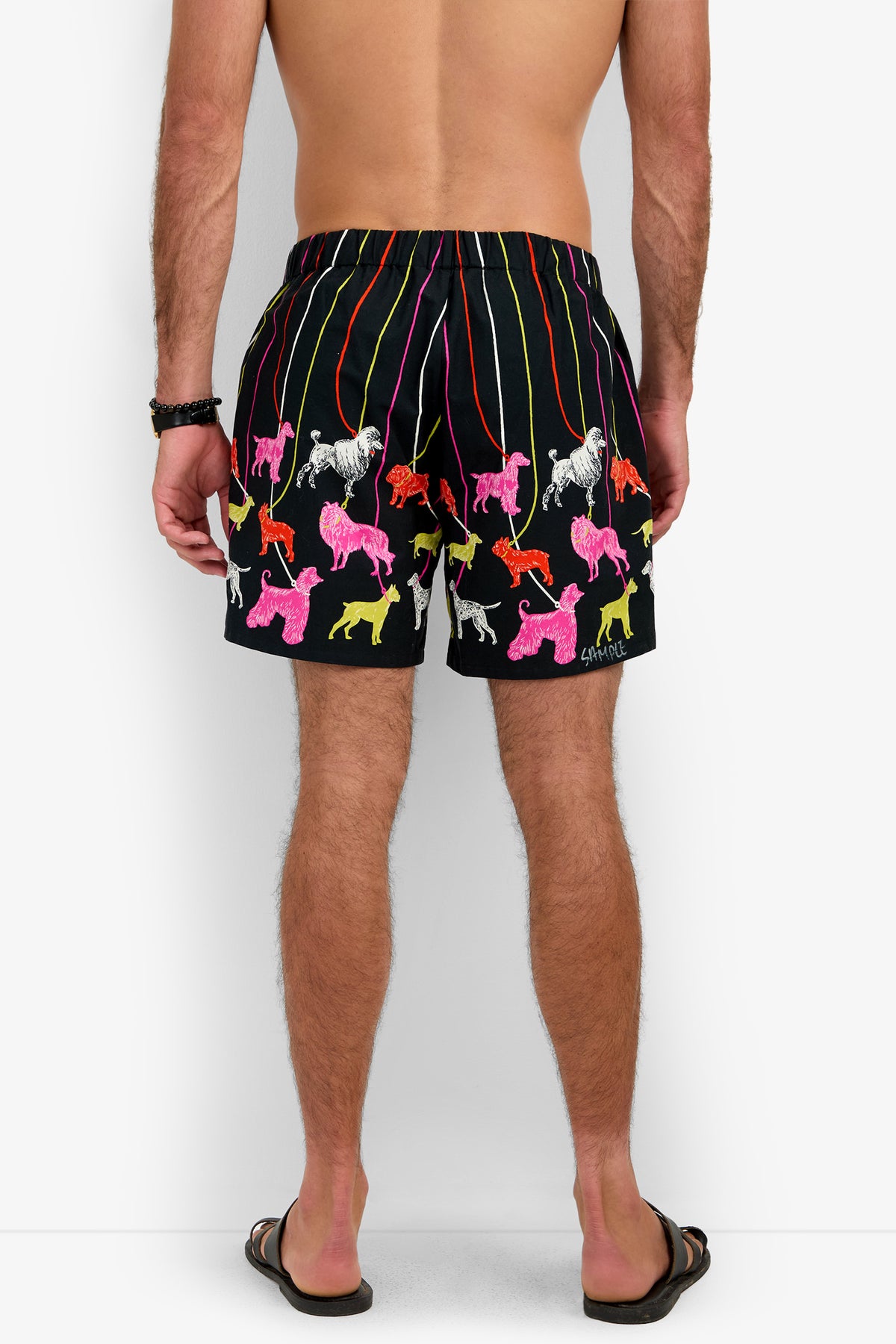 PJ SHORT black shorts with a pattern of colorful, sketch-style dog silhouettes on leashes.