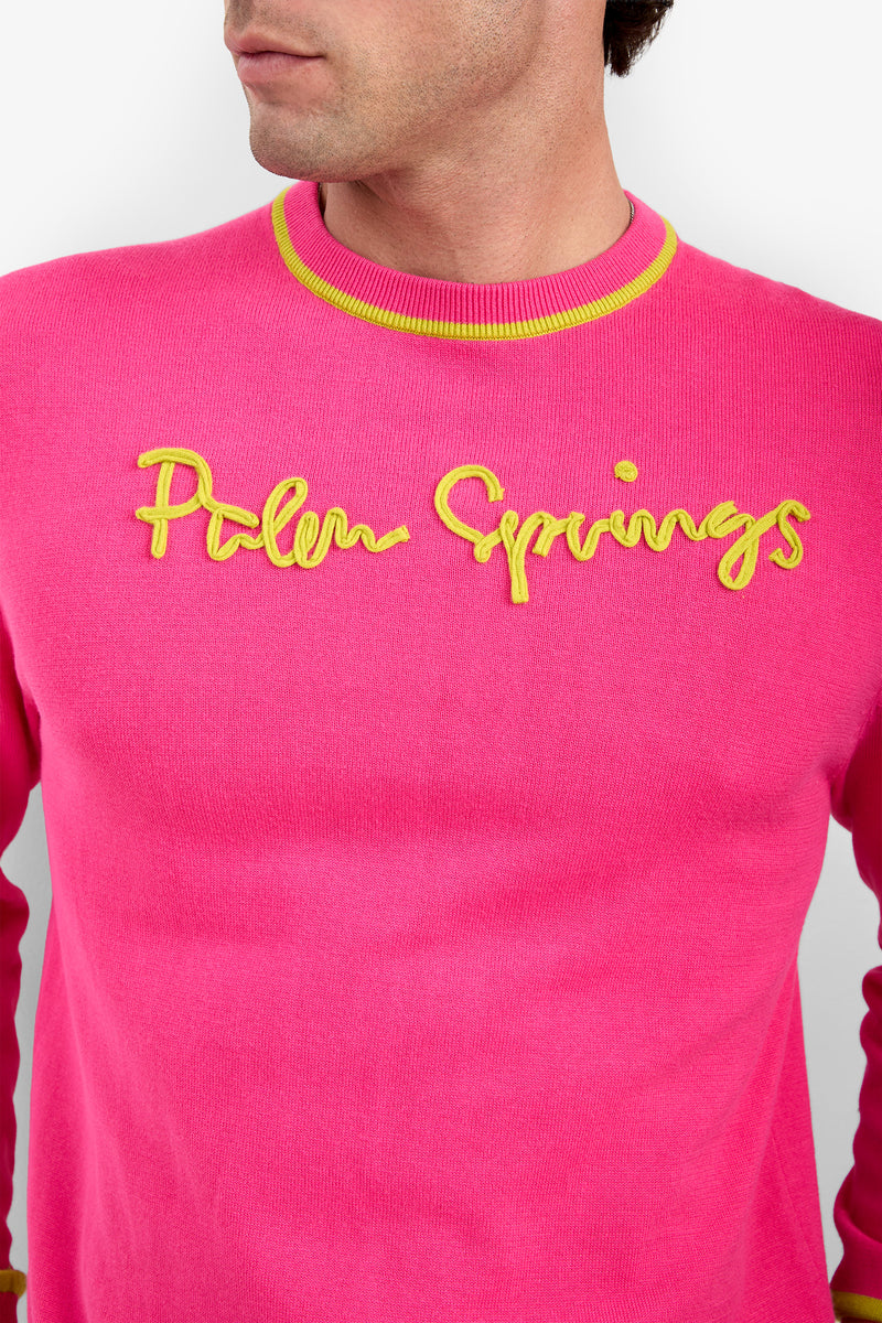PALM SPRINGS CREWNECK in bright pink cotton modal featuring a yellow ribbed neckline and yellow script embroidery across the chest.
