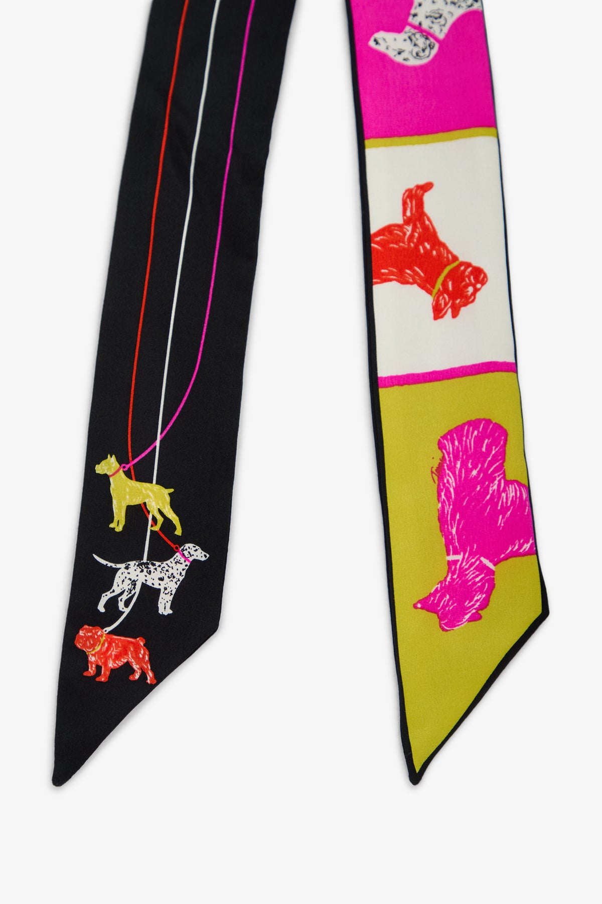 POOCH TWILLIE SCARF, a long, narrow 100% silk scarf with a black side featuring dogs on leashes and a colorful side with dogs in blocks of pink, cream, and olive green.