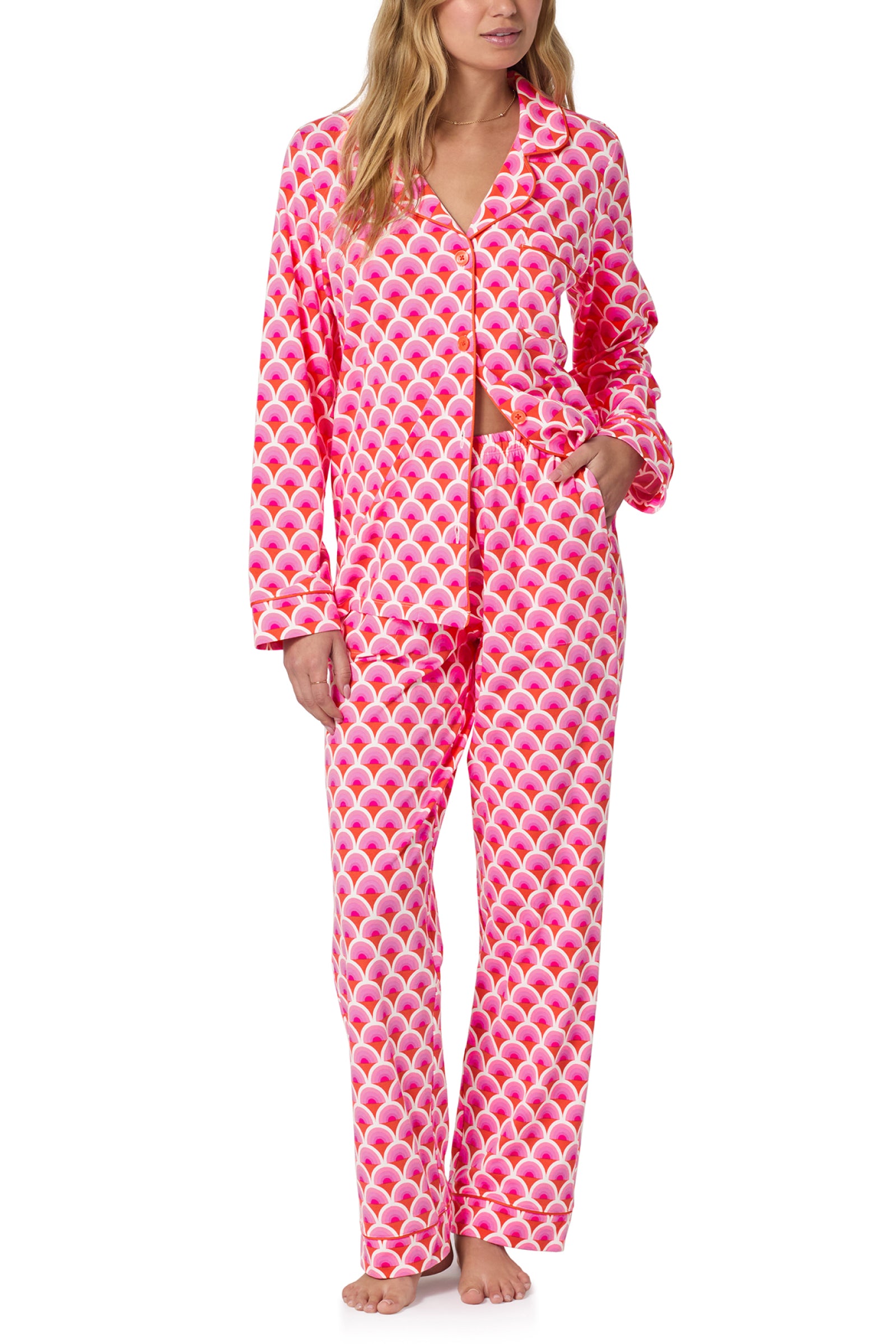 A woman stands barefoot with one hand in her pocket, wearing the Classic PJ Set - Scallop in MULTI.