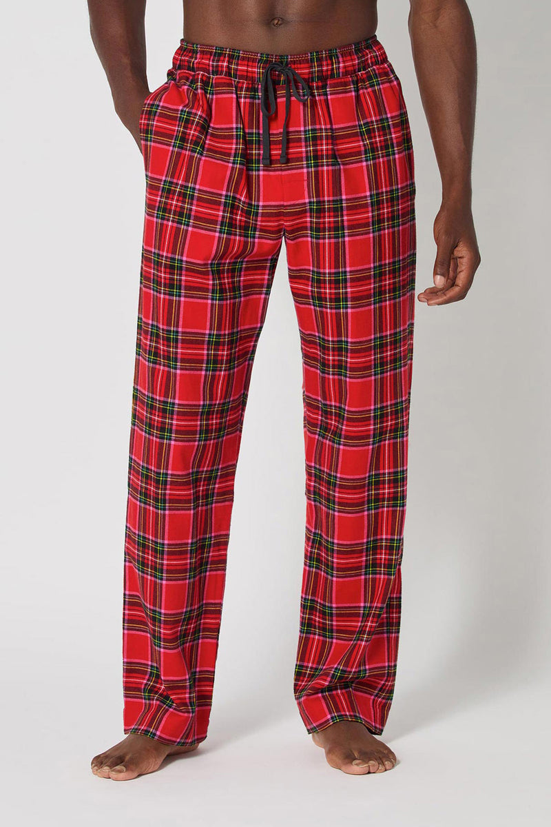 A person, mostly out of frame, stands barefoot against a plain white background wearing Christmas Plaid Men Pj Pant with a black drawstring.