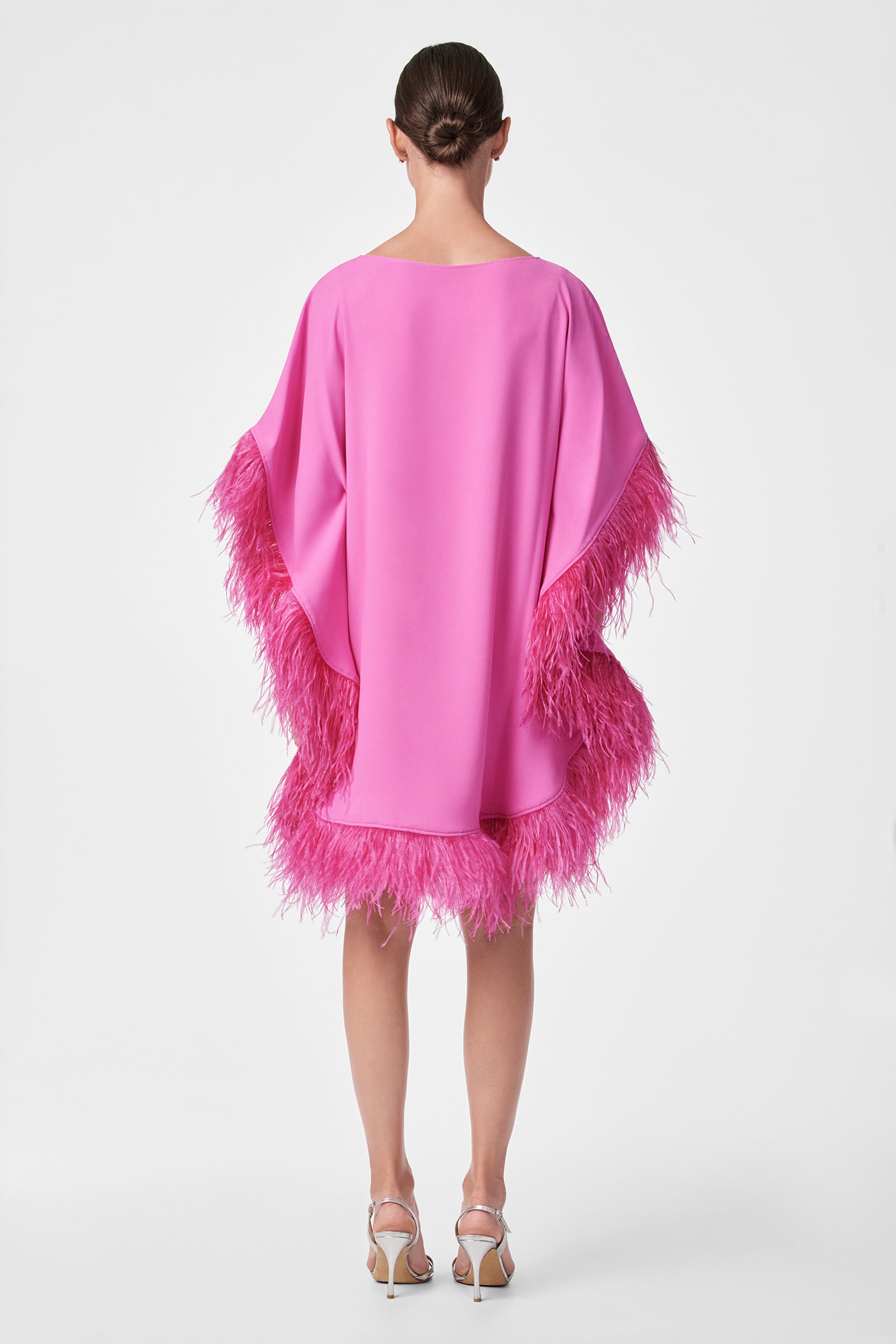 A woman in a Mini Neena Caftan Dress.