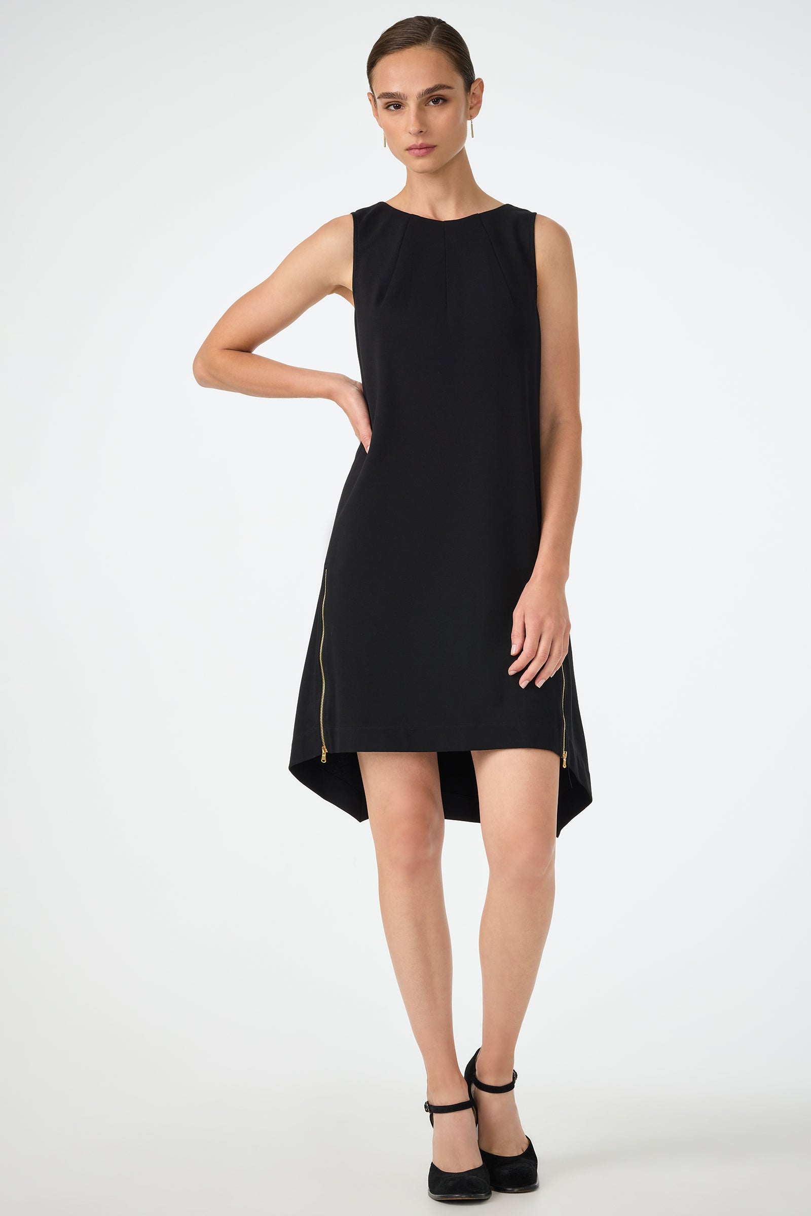 A woman in the Vantis High-Low Sleeveless Dress.