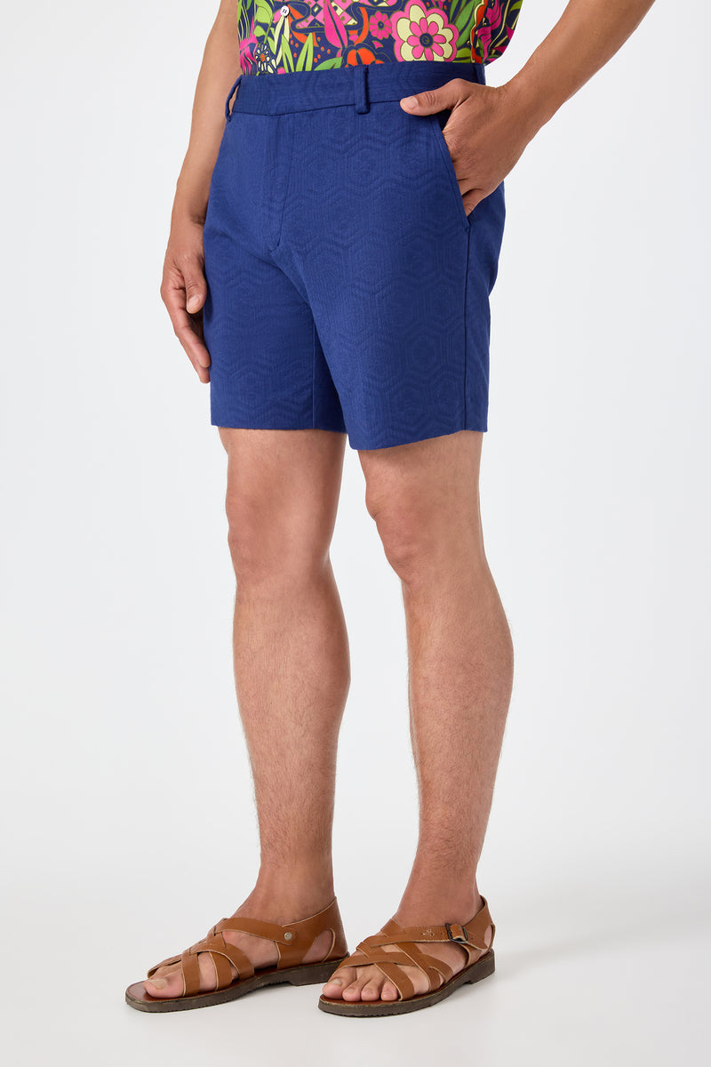 Wearing the Lawrence Short - Noh Nightfall, a person stands with hands in pockets against a plain white background.