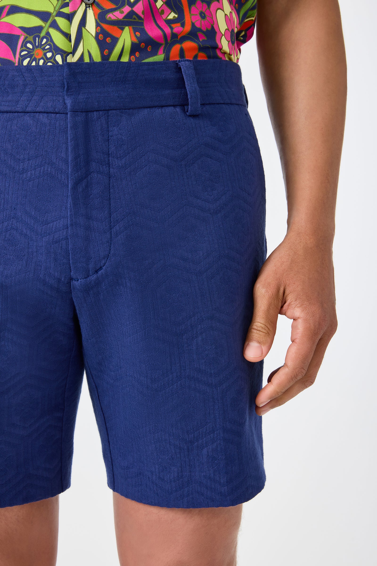 A person wears the Lawrence Short - Noh Nightfall, showing only their lower torso and right hand against a plain white background.