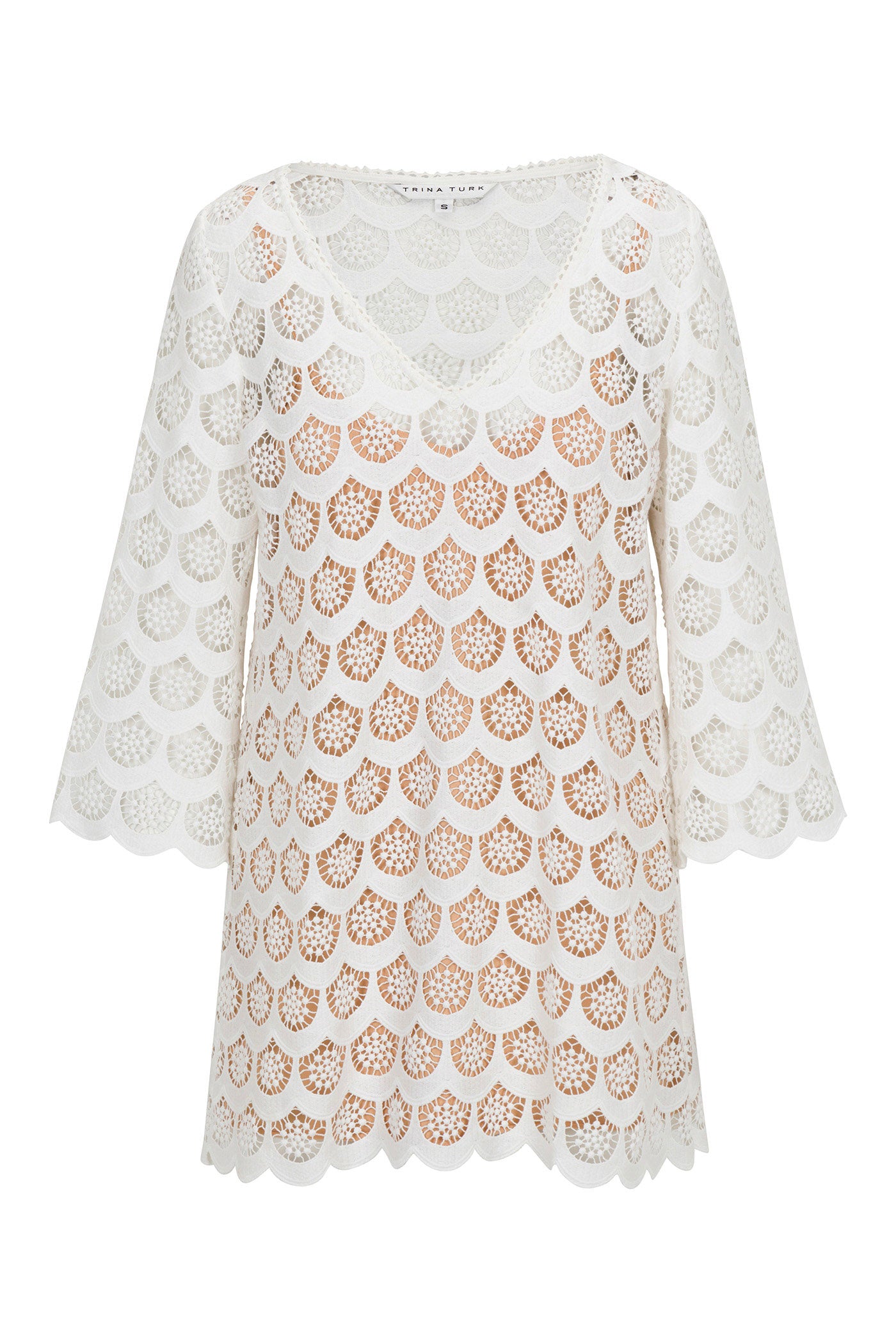 The Lita Crochet 3/4-Sleeve Dress showcases a white see-through lace design with a scallop pattern, V-neckline, and three-quarter sleeves for a delicate and airy look.