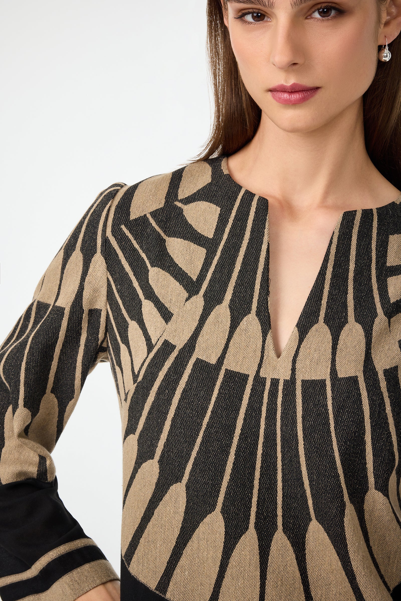 A woman with straight brown hair wears the Amy 3/4 Sleeve Top in Juniper Fil Coupe. The image is cropped to show her face and upper torso against a plain background.