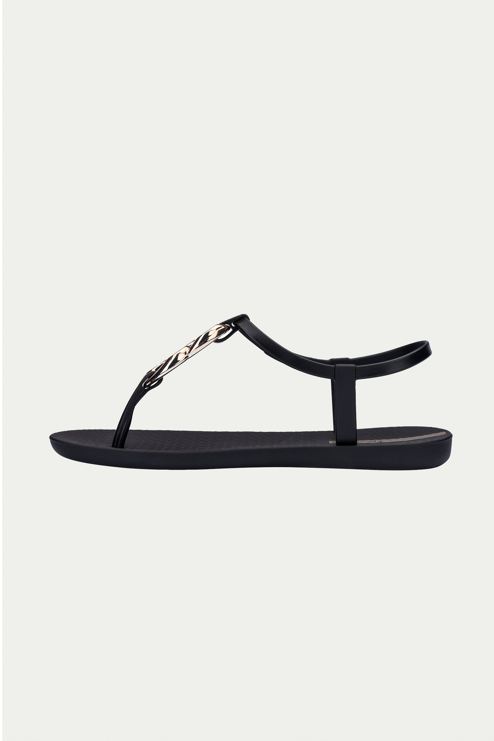 The Ipanema Class Connect Sandal - Black is a flat sandal featuring a thin ankle strap and gold chain detail on the front strap, shown in a side view against a light background.