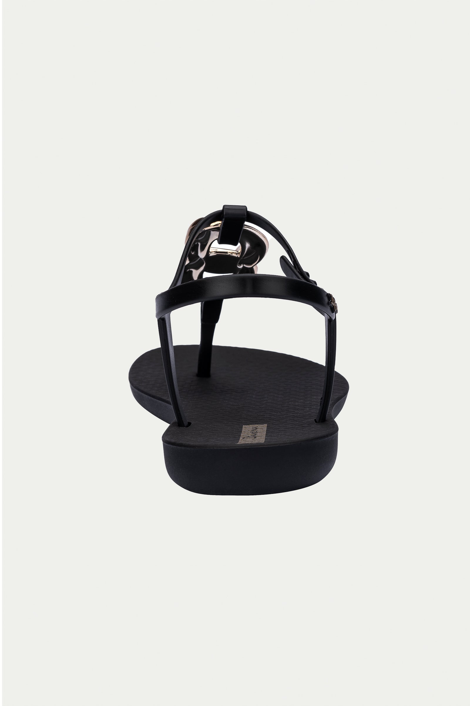 The Ipanema Class Connect Sandal in black is shown from the back, with a flat sole, slim ankle straps, and a metallic accent near the heel against a simple light background.