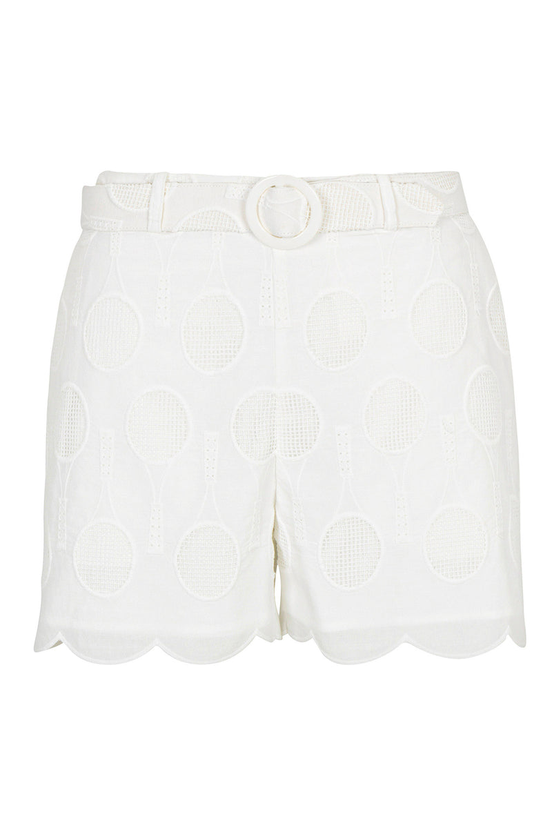 The Deuce Belted Short - Tennis Eyelet features a white high-waisted fit, scalloped hem, decorative round buckle belt, and an allover embroidered tennis racket pattern.