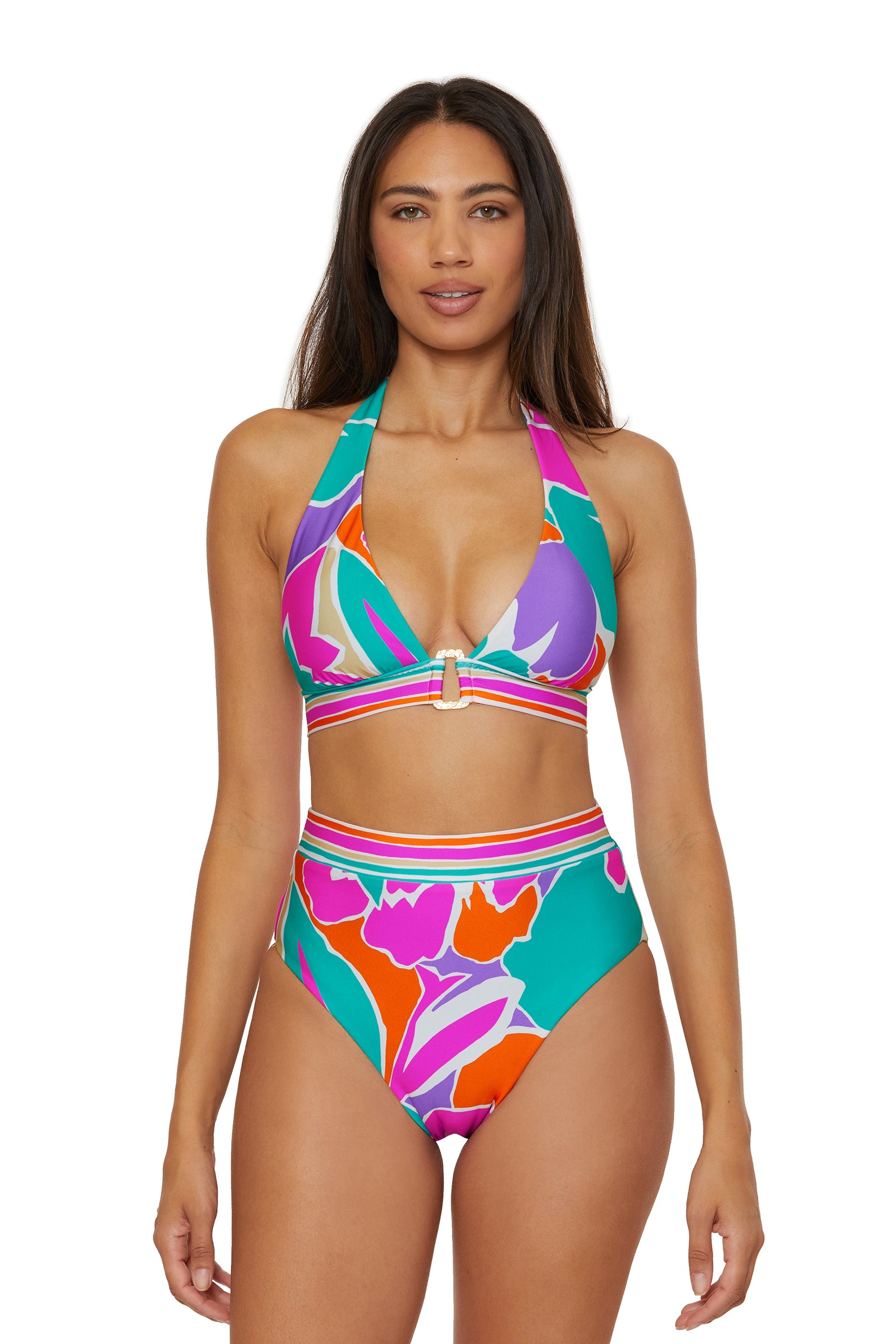 A woman faces forward against a white background wearing the Ring Halter Top Swim Top - Amalfi, a colorful bikini with a halter top and high-waisted bottoms in bold purple, orange, green, and pink abstract print.
