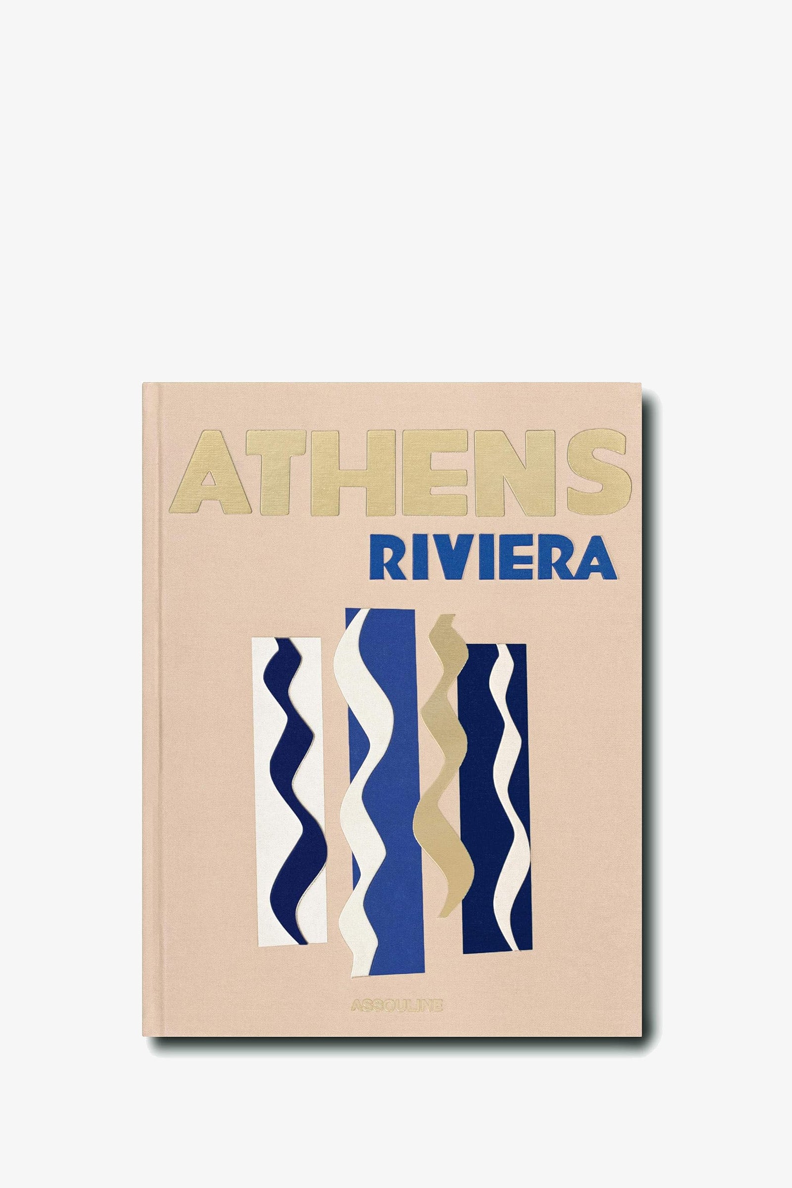 The Assouline Athens Riviera Book features a beige cover adorned with abstract wavy vertical lines in blue, white, and gold tones.