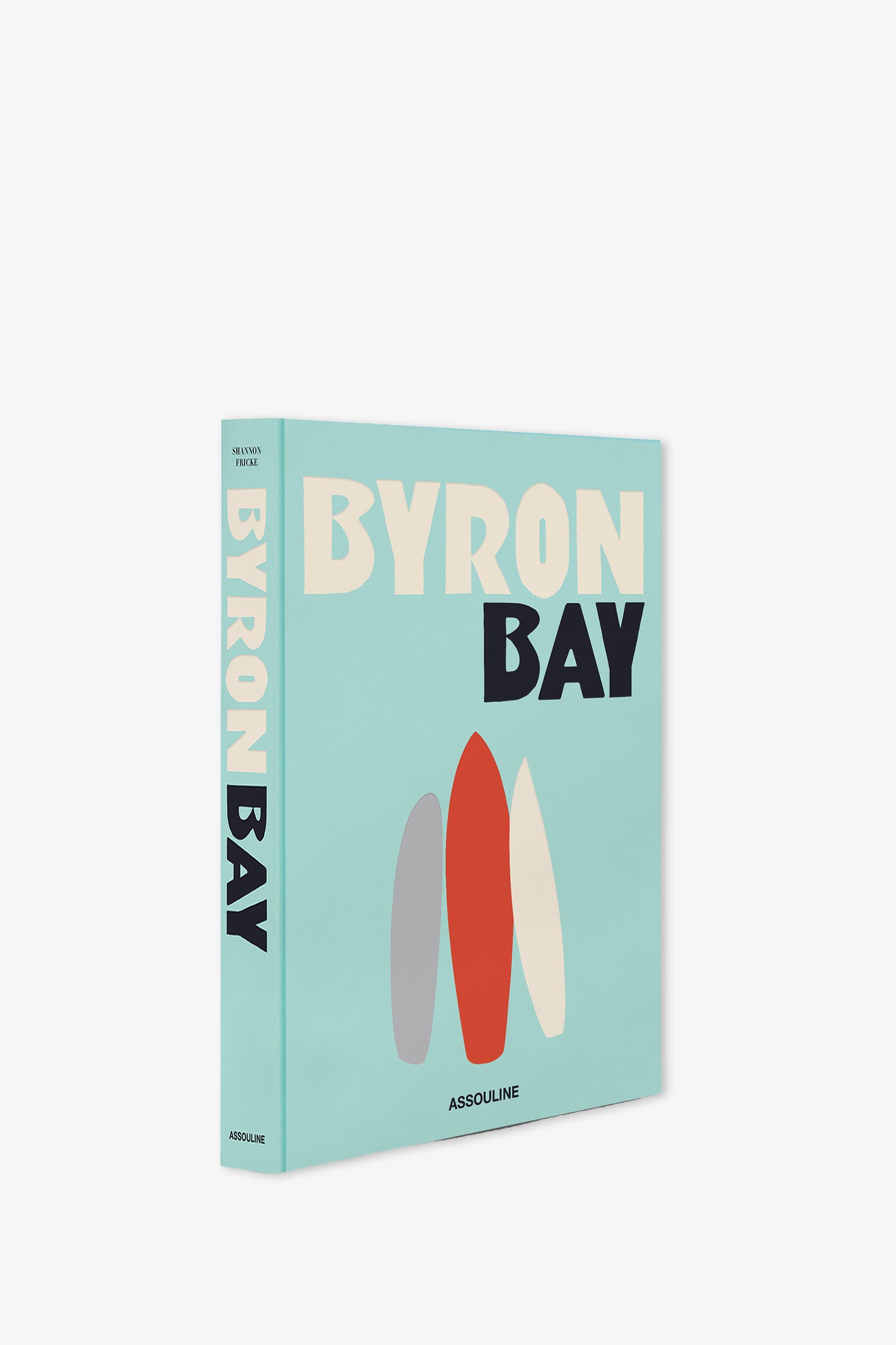 A light blue book titled ASSOULINE BYRON BAY in large, bold letters, featuring three stylized surfboards on the cover. The spine also displays ASSOULINE BYRON BAY, with the publisher's name, Assouline, at the bottom.