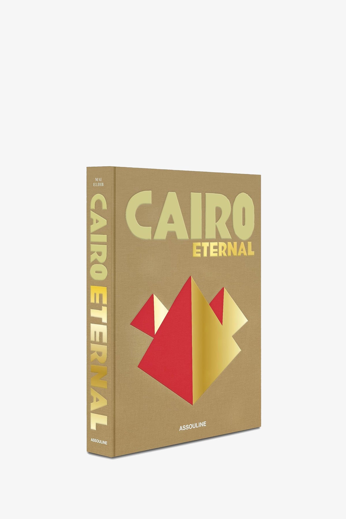 A tan Assouline Cairo Eternal book shown at an angle, with the red and gold pyramid design on the cover and the title in gold along the spine.