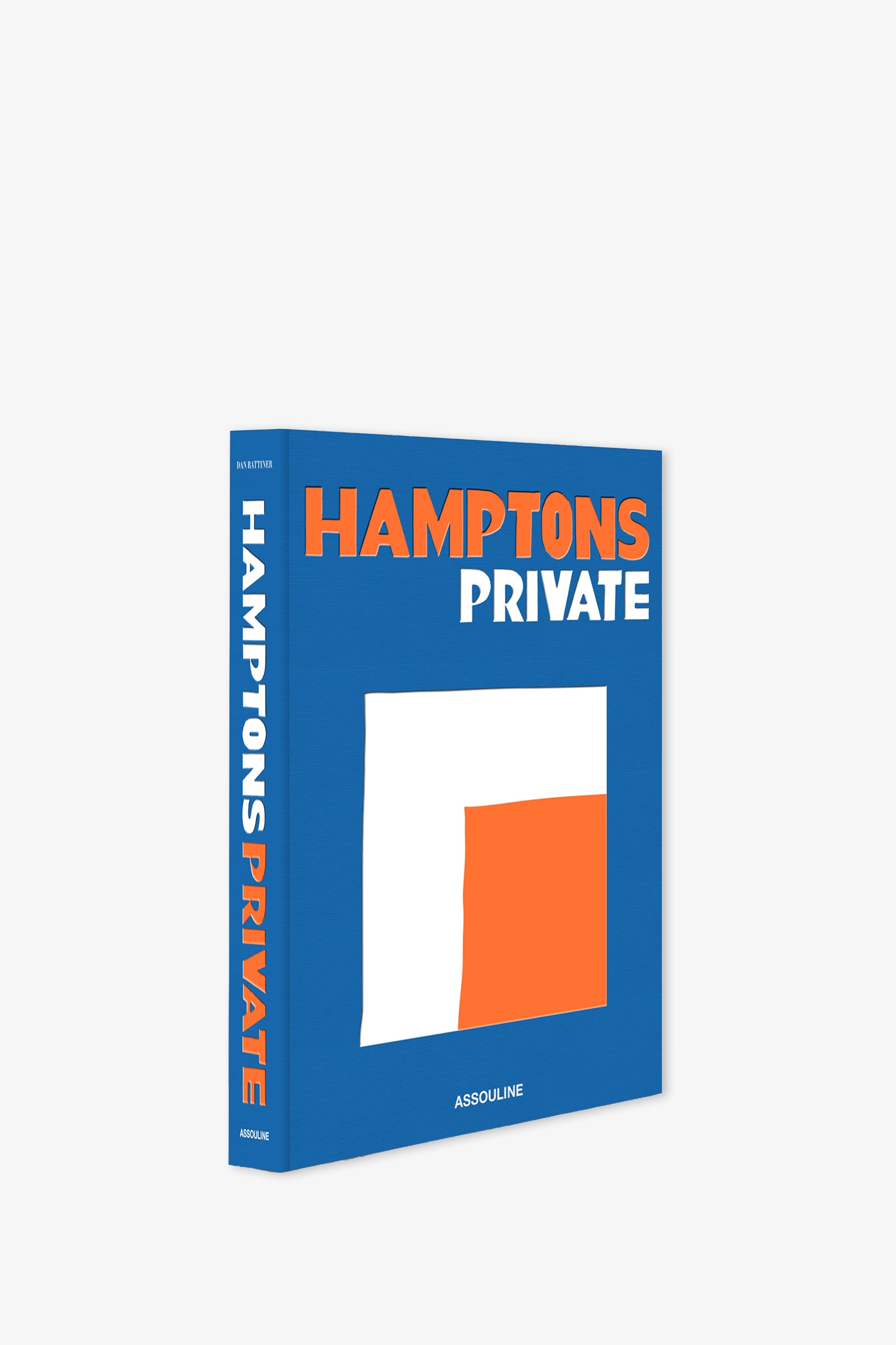 A blue Assouline Hamptons Private Book featuring bold orange and white text and a minimalist white and orange abstract design on the cover.