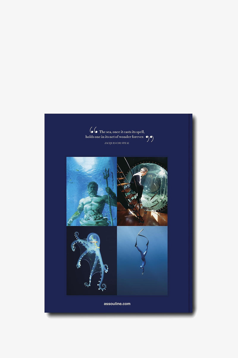 The cover of Assouline Ocean Wanderlust is blue and features four underwater images: a man with a trident, a person in a diving suit, a jellyfish, and an acrobat in a hoop. A Jacques Cousteau quote appears at the top.