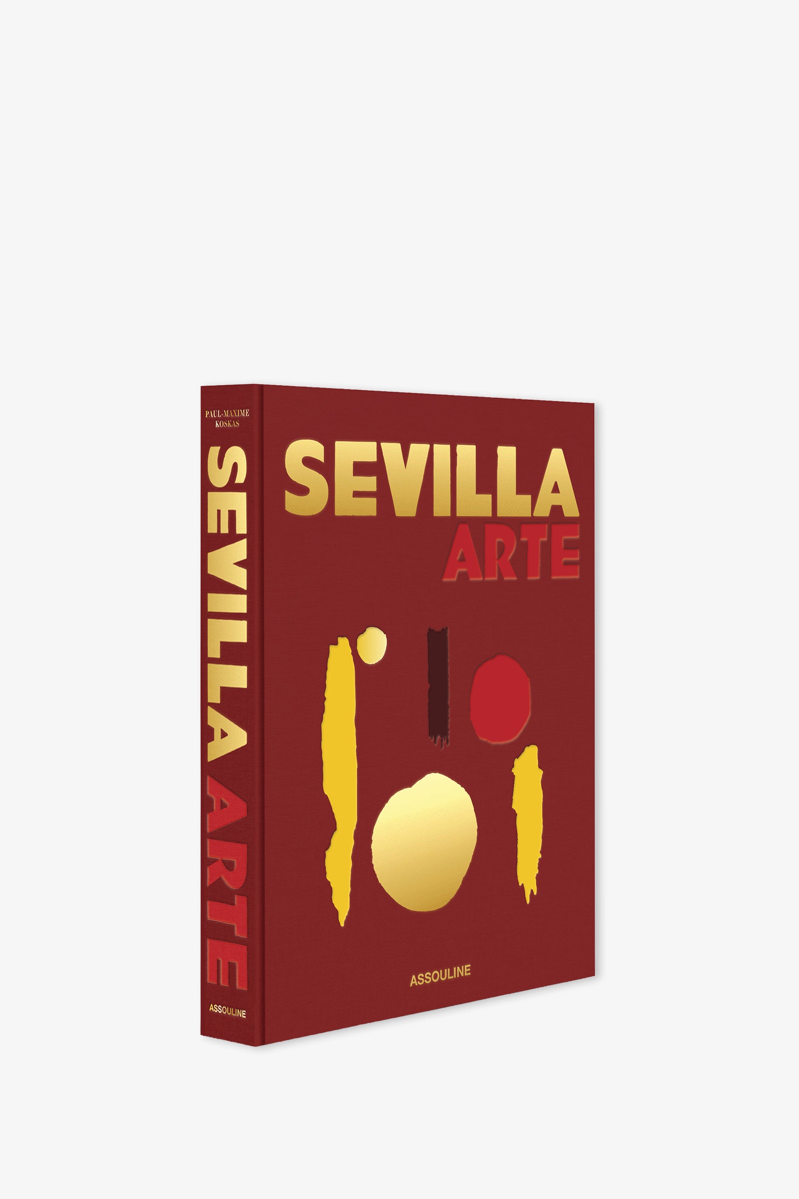 The Assouline Sevilla Arte Book is a red hardcover featuring bold yellow and red text and abstract shapes on the cover, with the title displayed vertically in yellow and red along the spine.
