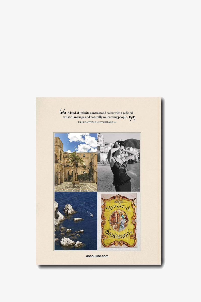 The back cover of the Assouline Sicily Honor book features a quote above four photos: a sunlit stone courtyard, a black-and-white portrait of a couple, rocky coastline with blue sea, and an ornate yellow painted sign.