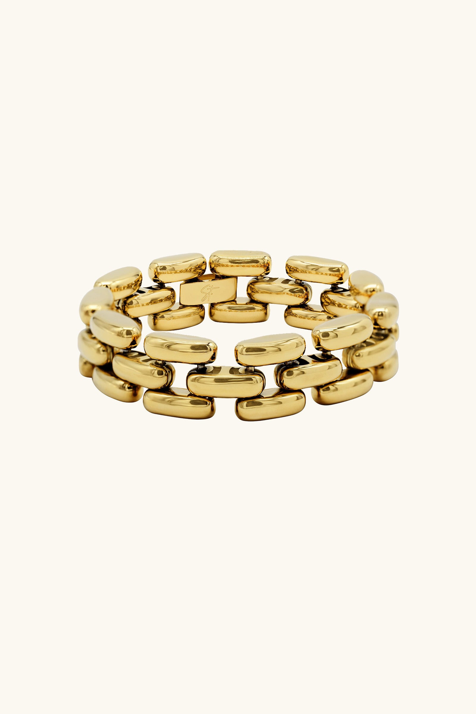 The Phoebe Bracelet in gold features three rows of smooth, rectangular links stacked in a brick-like pattern and is displayed against a plain, light background.