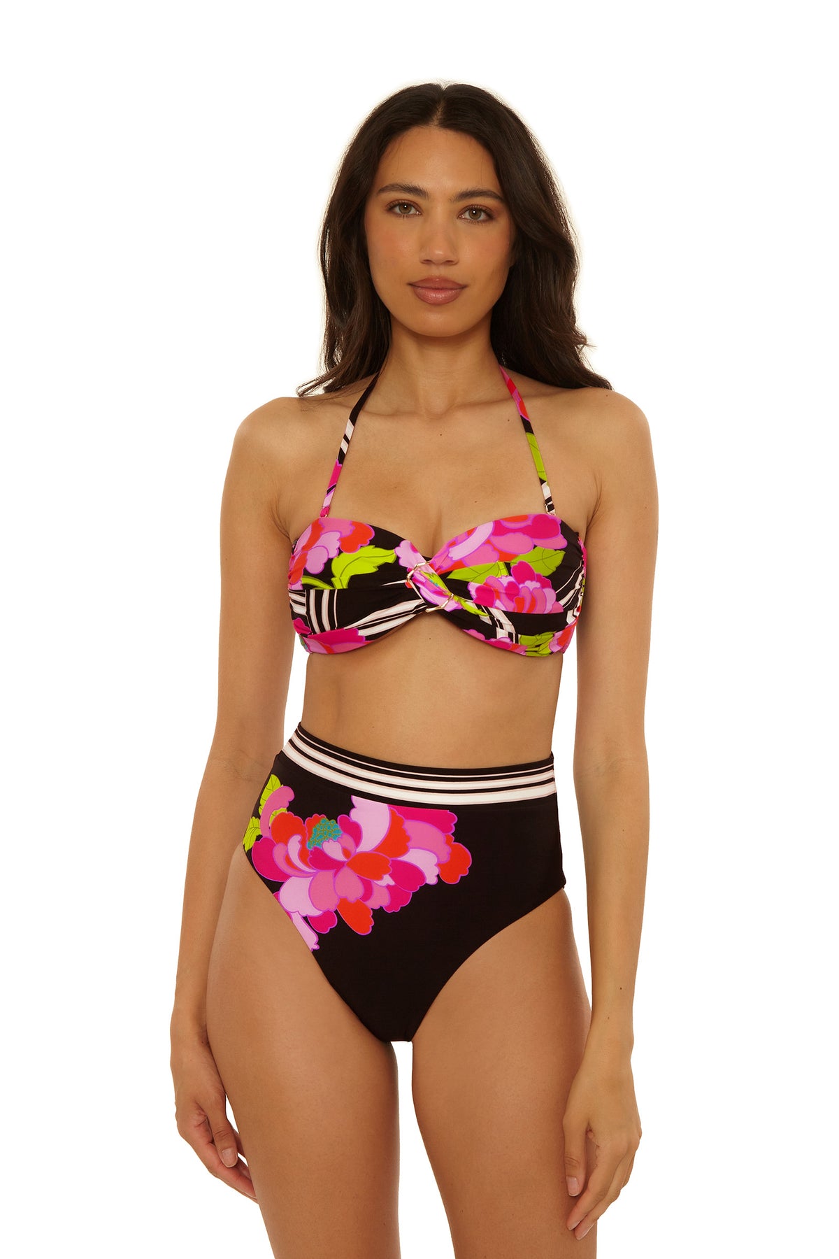 A woman models the High-Waist Swim Bottom - Bougainvillea, featuring a colorful floral and striped pattern in pink, green, and black, against a plain white background.