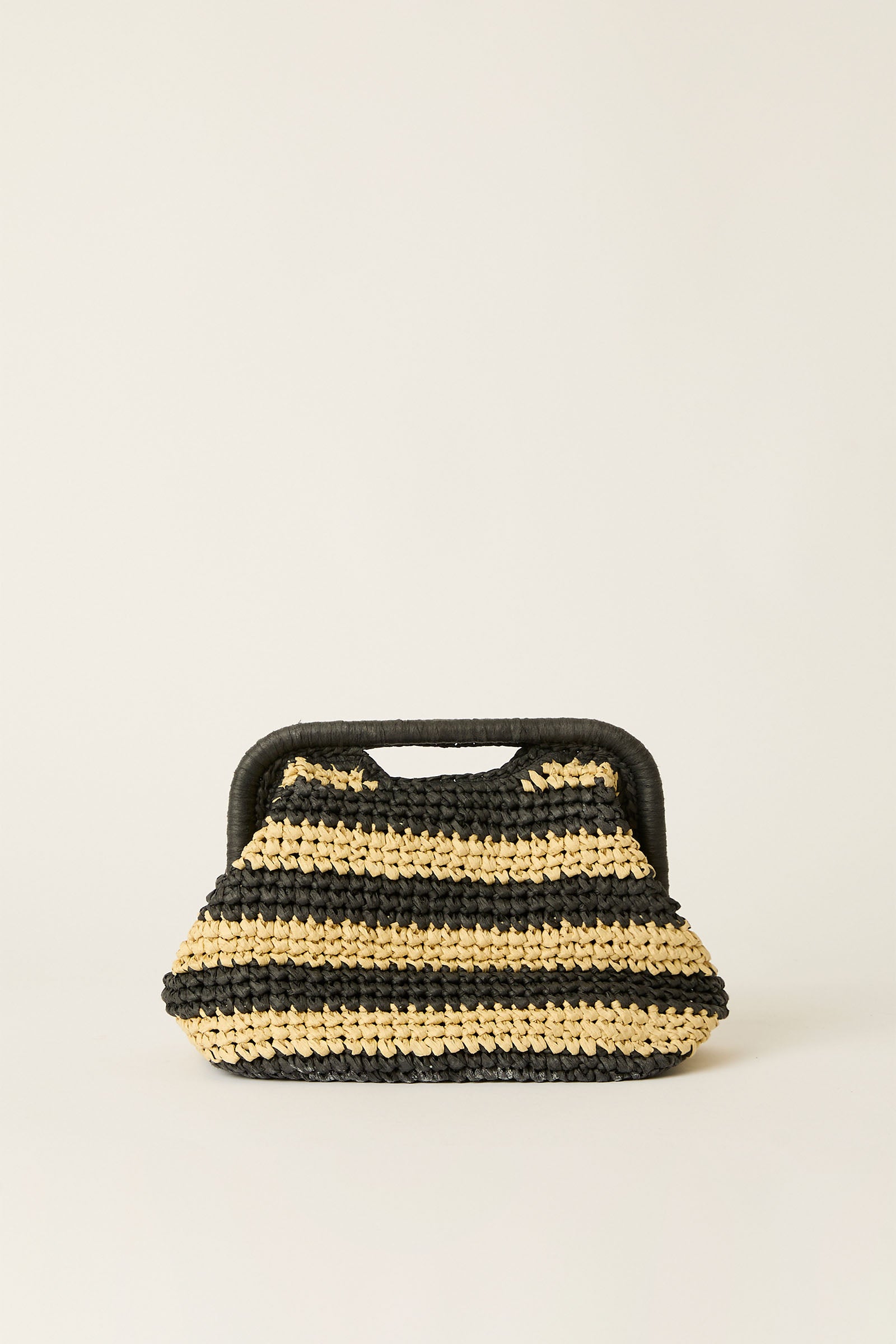 The BTB Torino Stripe Clutch in natural/black features woven horizontal stripes and a black rectangular handle, displayed against a plain light background.