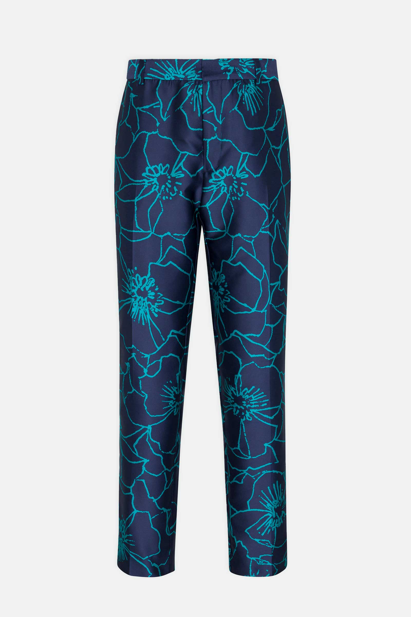 The Clyde Slim Trouser - Jucara Jacquard features a navy blue base with a bold turquoise floral jacquard pattern in a slim, straight-leg cut, displayed against a plain light gray background.