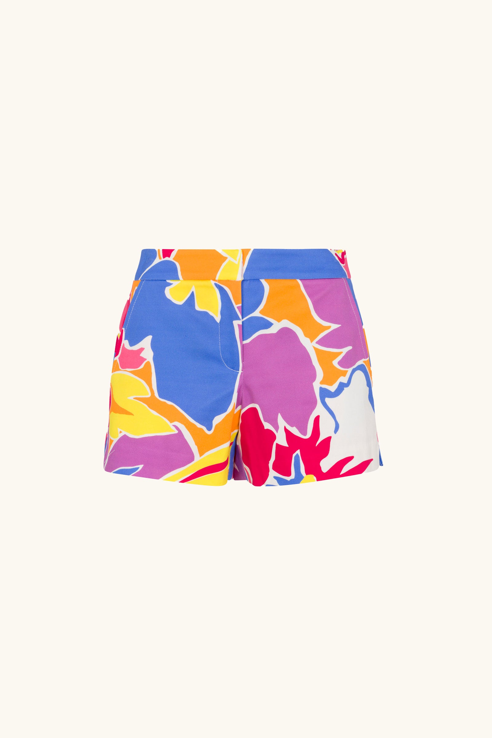 The Corbin 2 Shorts - Soie Paradis feature a bold, abstract floral print in blue, orange, yellow, red, and white on a light background. These tailored shorts offer side pockets for convenience.