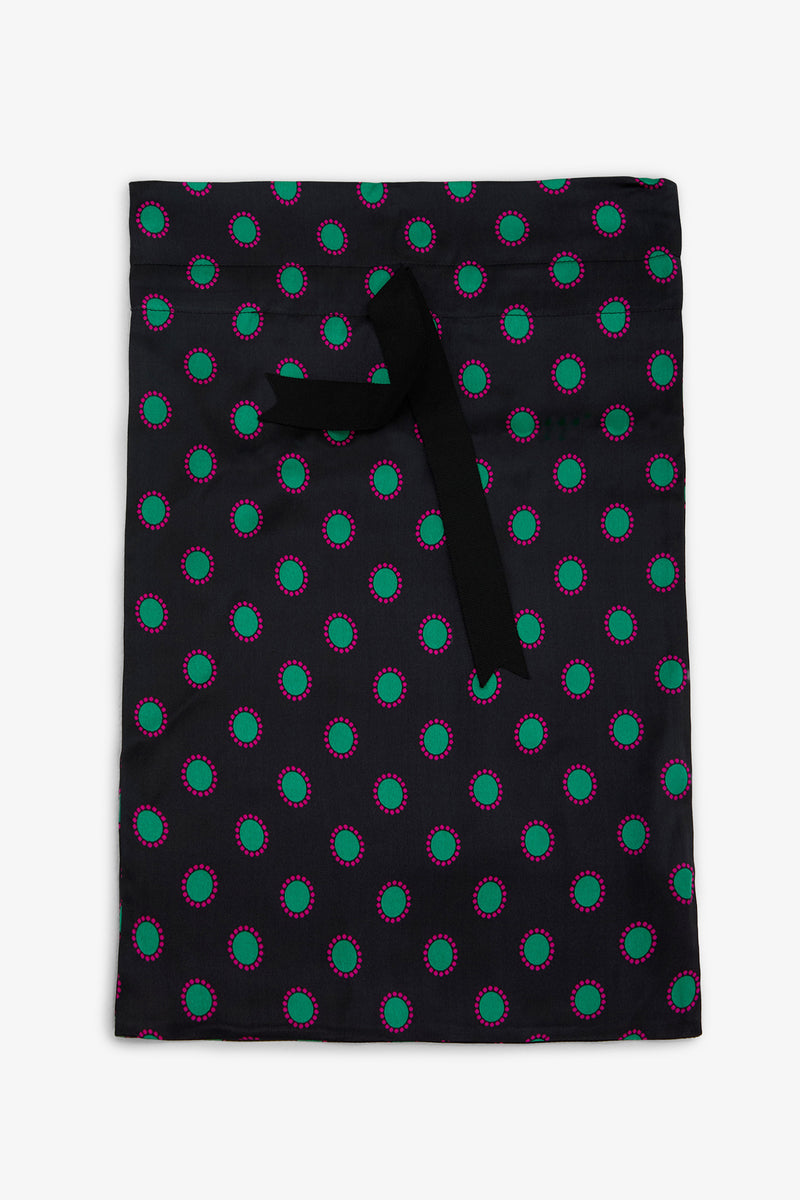 GEMSTONE PAJAMA GIFT BAG: a black drawstring bag featuring a repeating pattern of green circles outlined in pink.