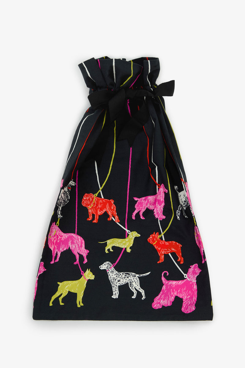 POOCH PAJAMA GIFT BAG: a black drawstring gift bag patterned with colorful illustrations of various dog breeds on leashes.