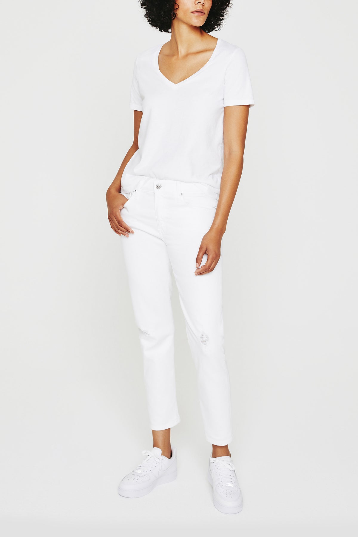 A woman wearing the AG Jager Vee Tee in white.