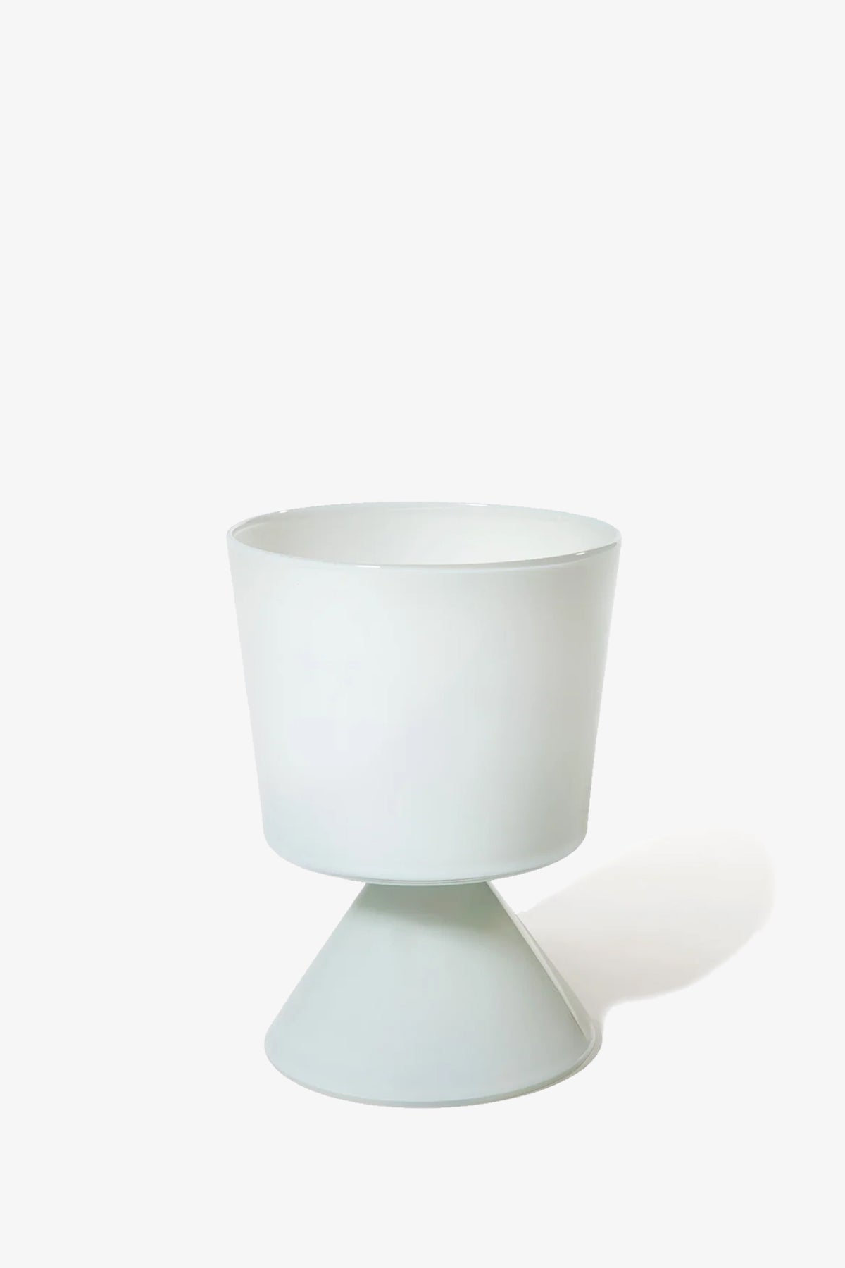 The Fiorelli Low Taper is a modern white planter featuring a wide cylindrical top and a cone-shaped base, shown against a plain white background.