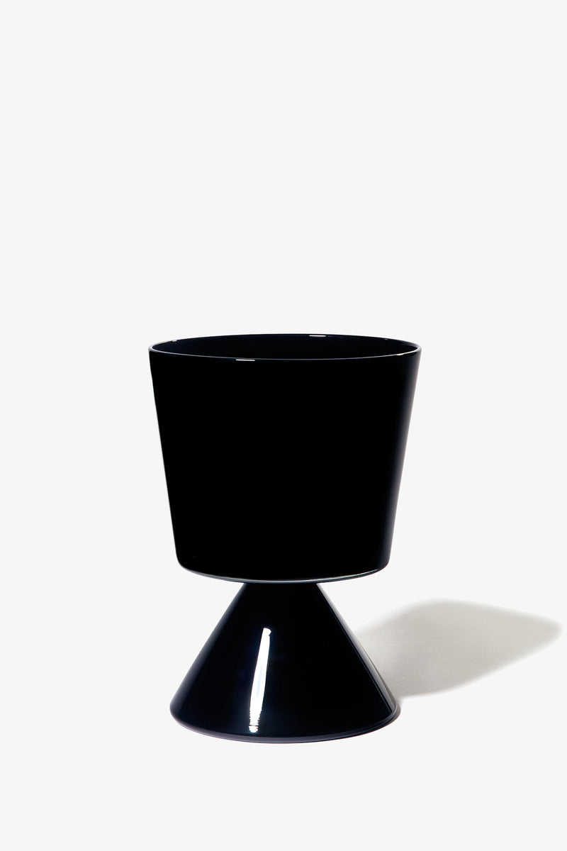 A black, glossy Fiorelli Low Taper planter with a wide top and conical base casts a soft shadow on a white background.
