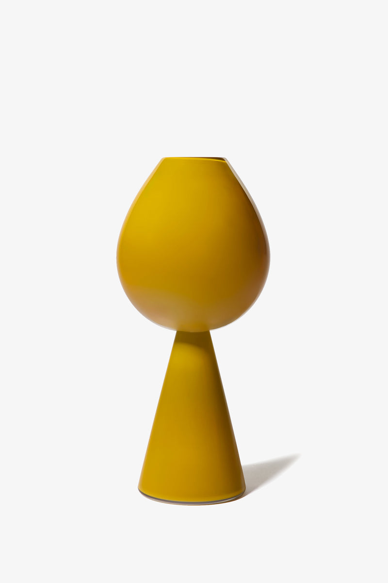 The Fiorelli Tulip is a modern yellow vase featuring a rounded top and a conical base, showcased against a plain white background.