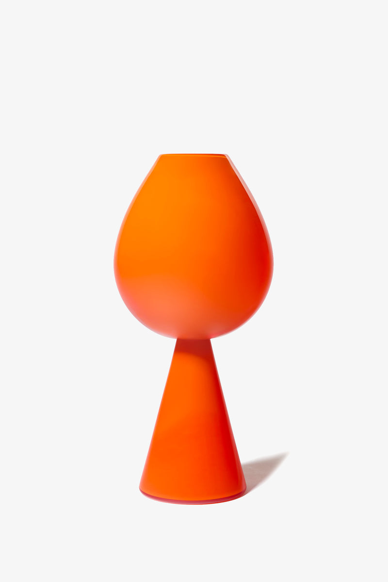 The Fiorelli Tulip is a modern vase featuring a bright orange hue, a bulbous top, and a conical base, presented against a plain white background.