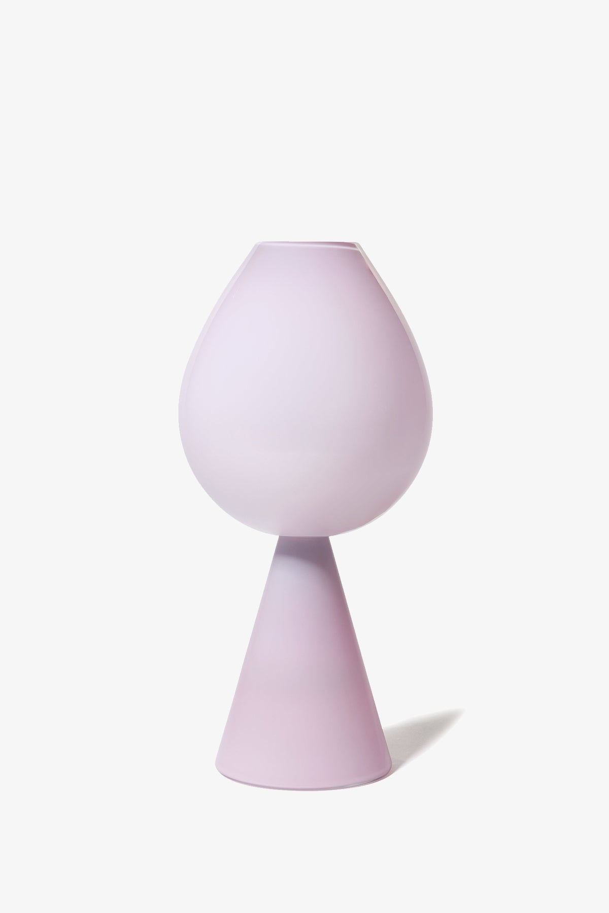 The Fiorelli Tulip is a modern, minimalist vase in pale pink featuring a spherical top and conical base, displayed against a plain white background.