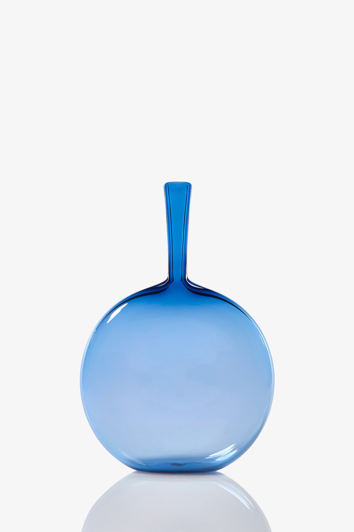 The Flask Angelic Bottle is a round, flat vase with a narrow neck, crafted from translucent blue glass and shown against a plain white background.
