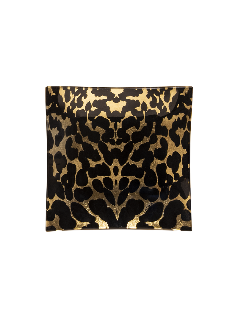 The Ortigia Gattopardo Glass Plate features a square shape with a LEOPARD black and gold abstract animal print design, shown on a plain white background.