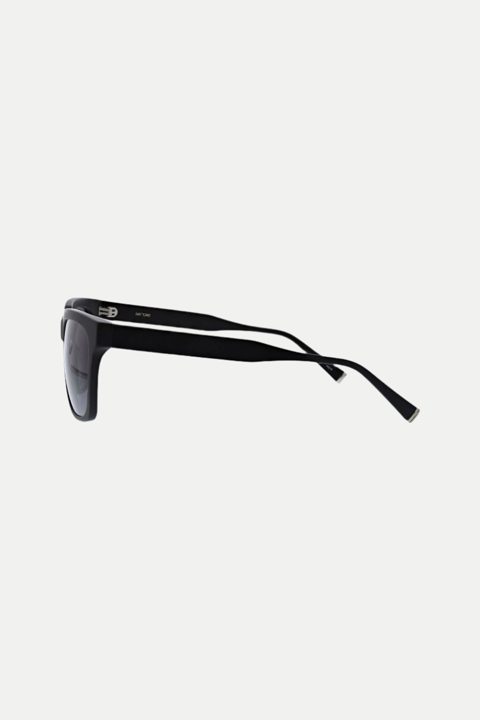 Side view of MRT Holl Square Acetate Sunglasses in black with dark lenses and thick frames, set against a plain white background. The slightly curved temple arms feature small metallic details near the hinges.