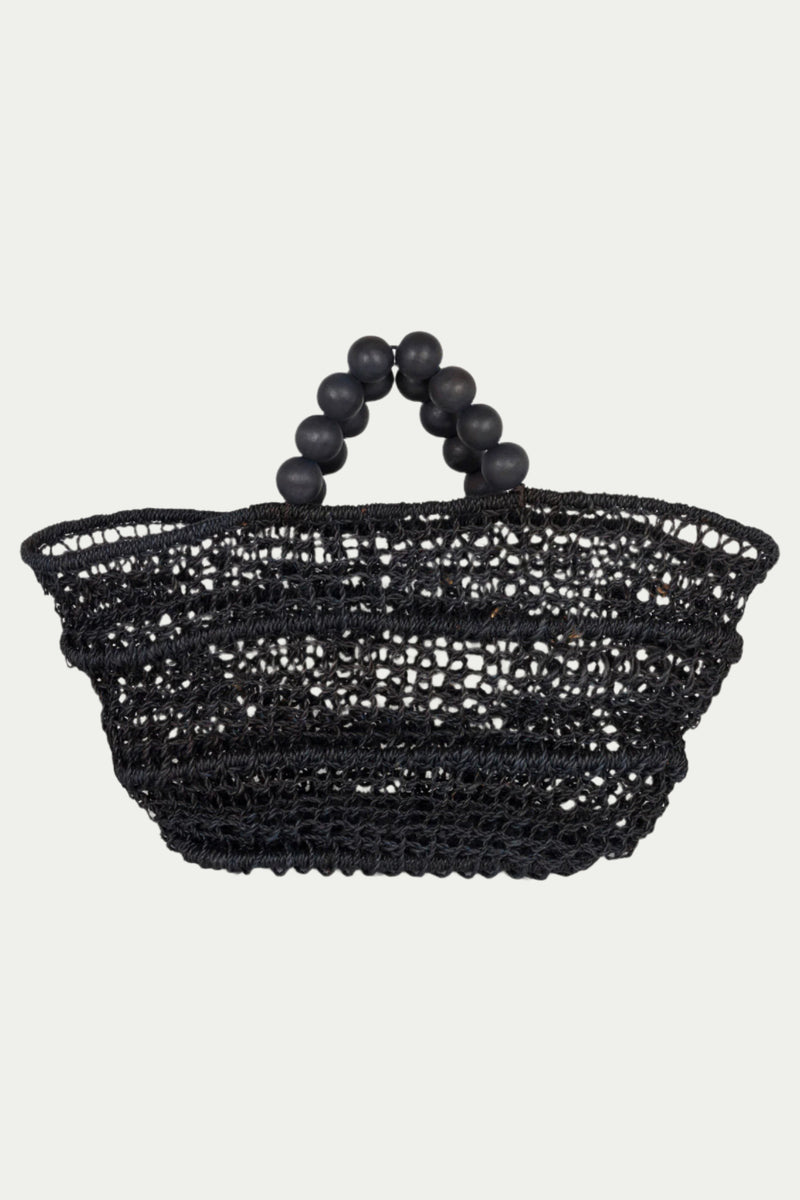The Poolside Comporta Black Open-Weave Tote in midnight blue features a round, open structure and two handles made of large beads, shown against a plain light background.