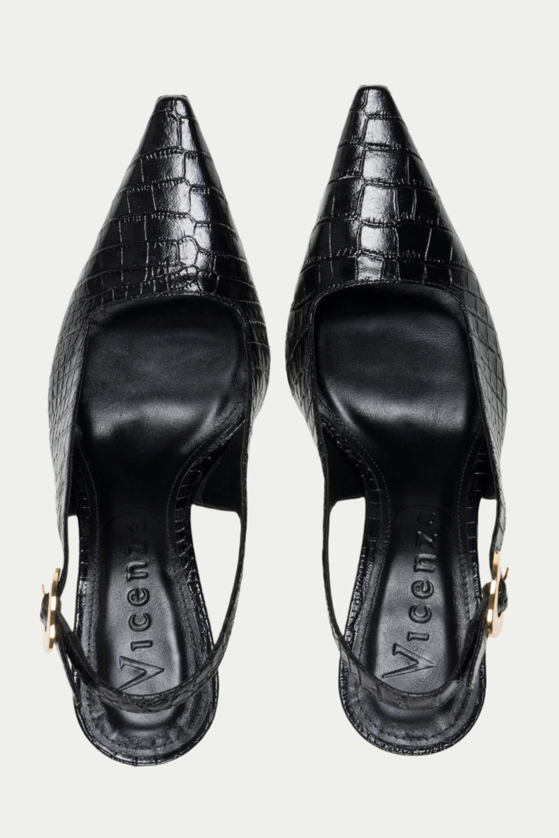 The Naomi Slingback Heel is a black, pointed-toe heel with a crocodile texture and gold buckle detail, shown from above.