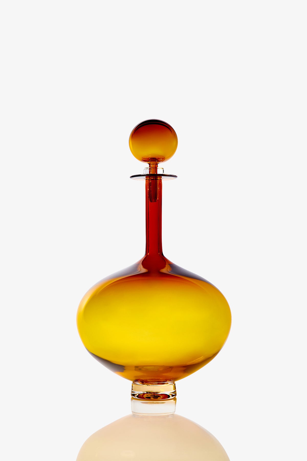 A Large Genie Bottle Decanter with a round stopper, featuring a yellow and amber gradient, set against a plain white background.