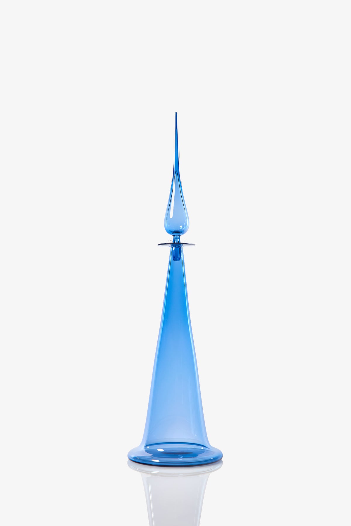 A Large Fluted Cone Decanter featuring a tall, elegant blue glass design with a wide base and a narrow, pointed tip, displayed against a white background.