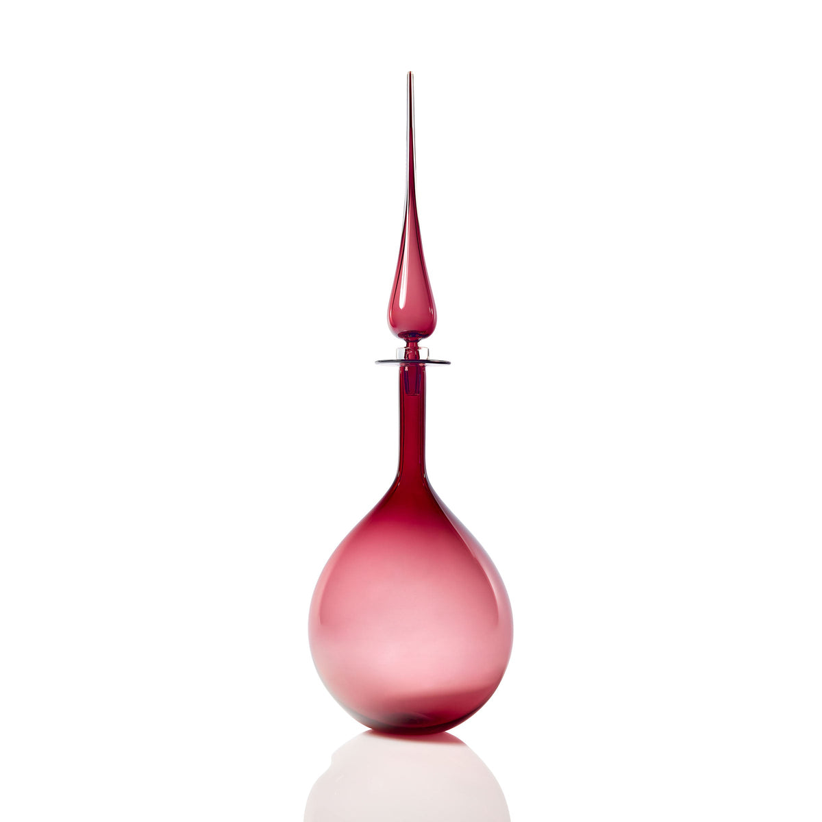 A large, elegant Rogue Glass Tear Drop Decanter with a long, narrow neck and a pointed stopper, placed on a white background.
