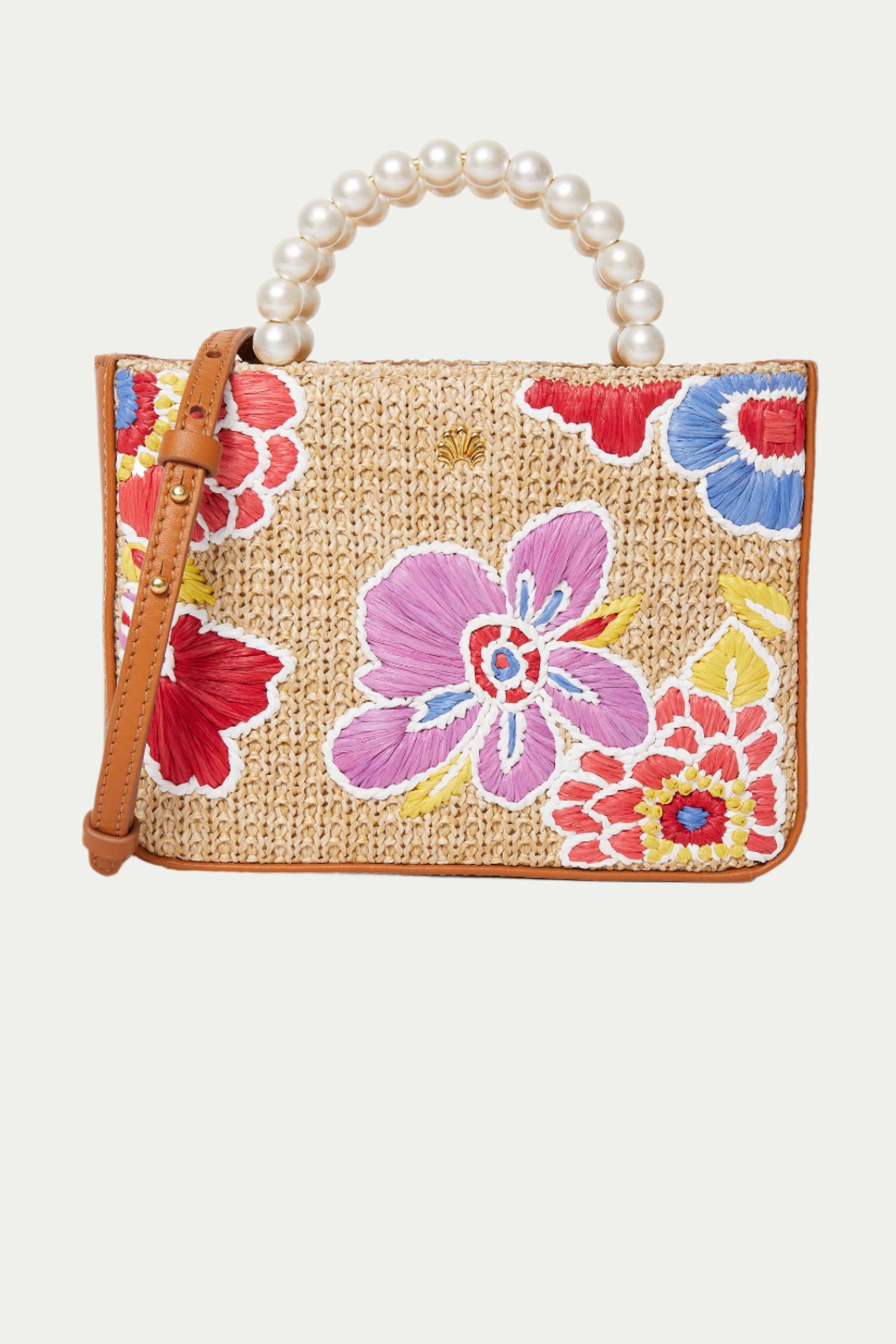 The Lele Sadoughi x Trina Turk Maya Floral Mini Tote features colorful embroidered flowers, a beaded pearl handle, and a brown leather shoulder strap.