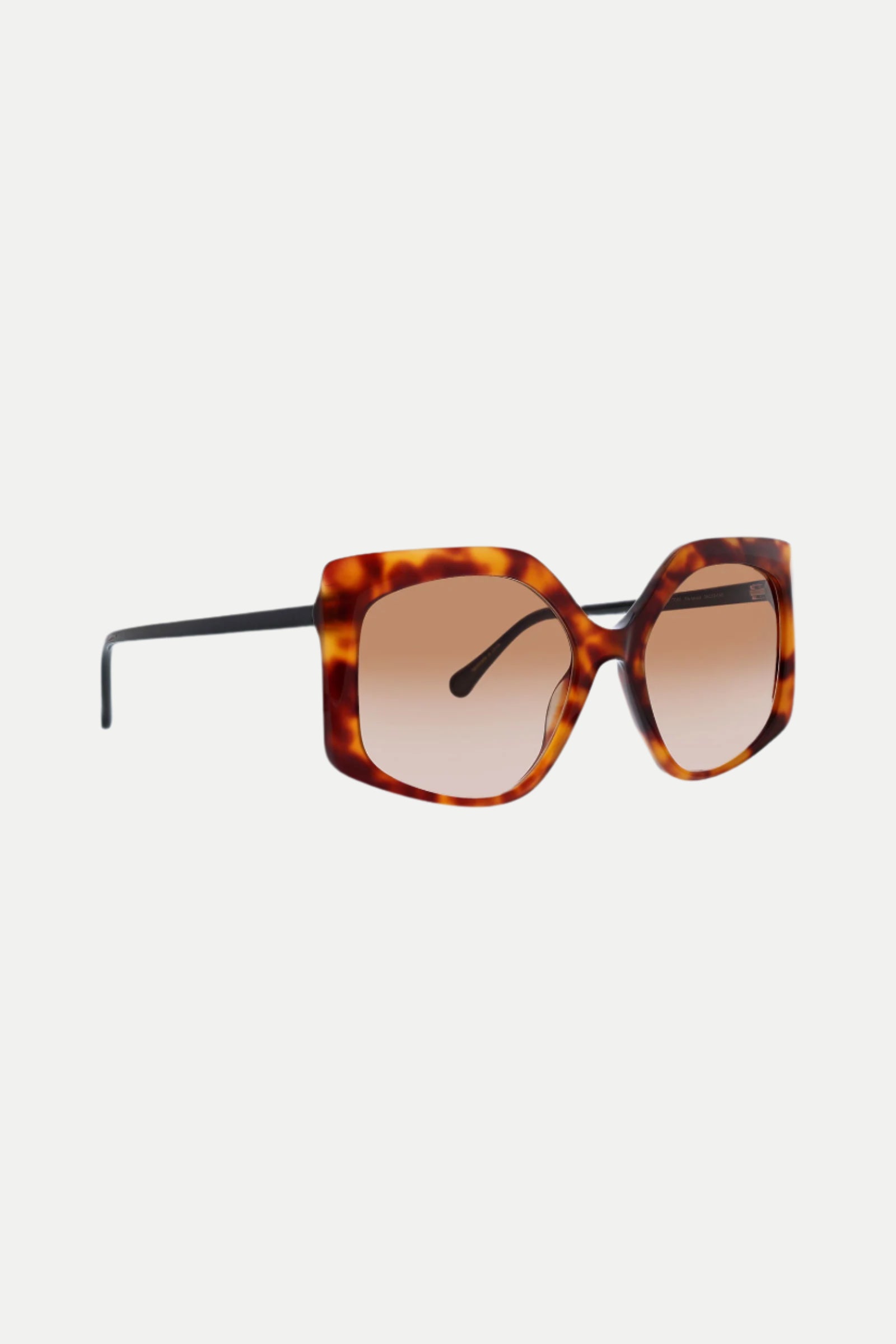 The Marasusa Geometric Acetate Sunglasses feature an oversized square tortoiseshell frame, black arms, and gradient brown lenses, displayed against a white background.