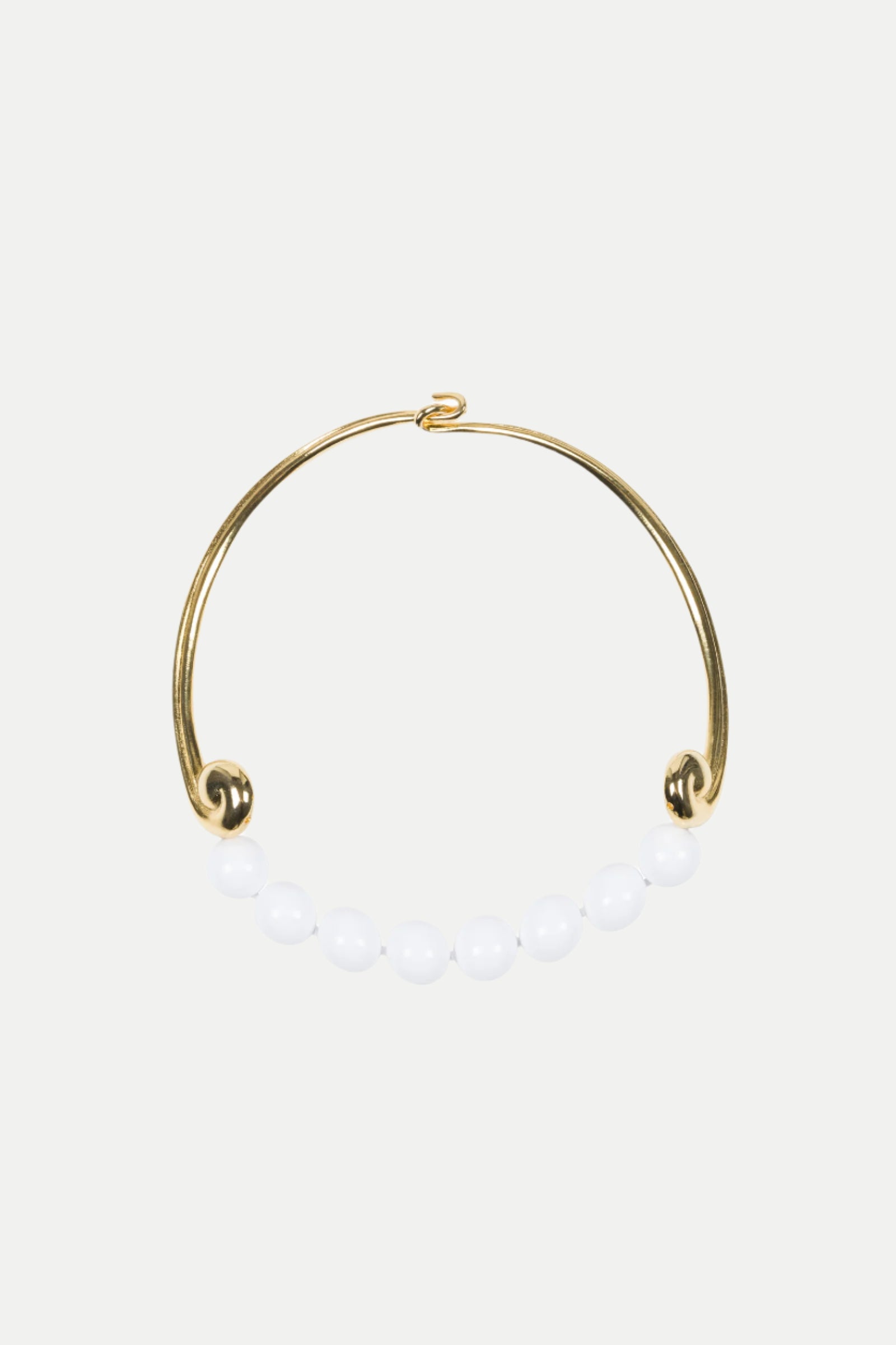 The KJL Beaded White and Gold Collar Necklace features a row of seven white round beads along the bottom, with an open hook clasp.